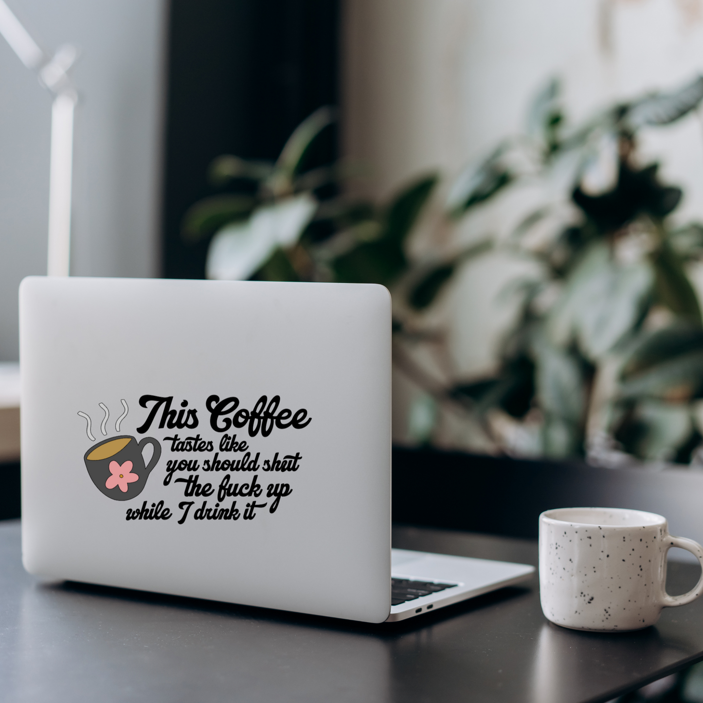 Vinyl decal of a steaming coffee mug with a pink flower and the phrase “This coffee tastes like you should shut the fuck up while I drink it”