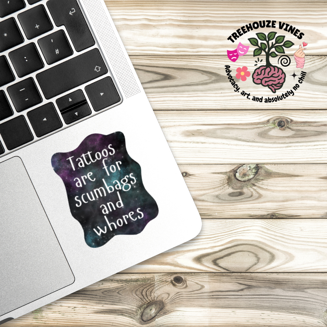 Sticker with a galaxy background and the phrase “Tattoos are for scumbags and whores” in white handwritten-style font