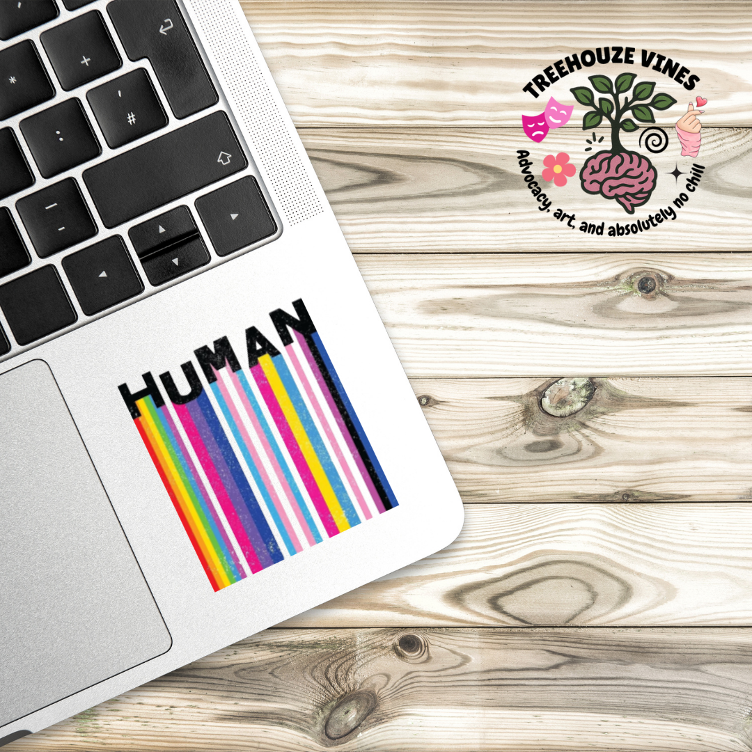 Square holographic sticker with rainbow barcode stripes and the word “HUMAN” in bold black text