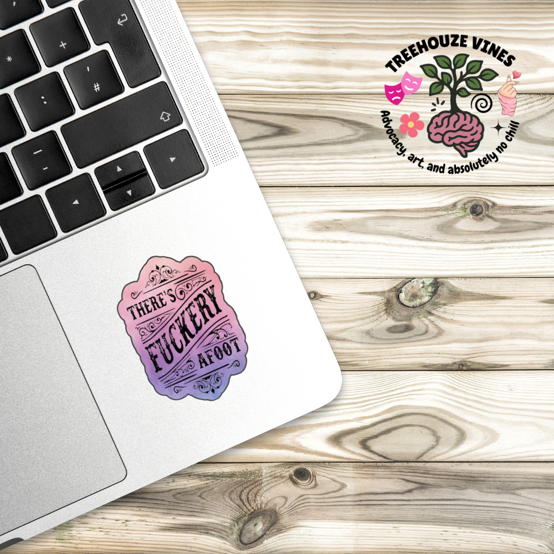 Sticker with ornate scrollwork and the phrase “There’s Fuckery Afoot” in black gothic-style lettering over a pink and purple gradient background