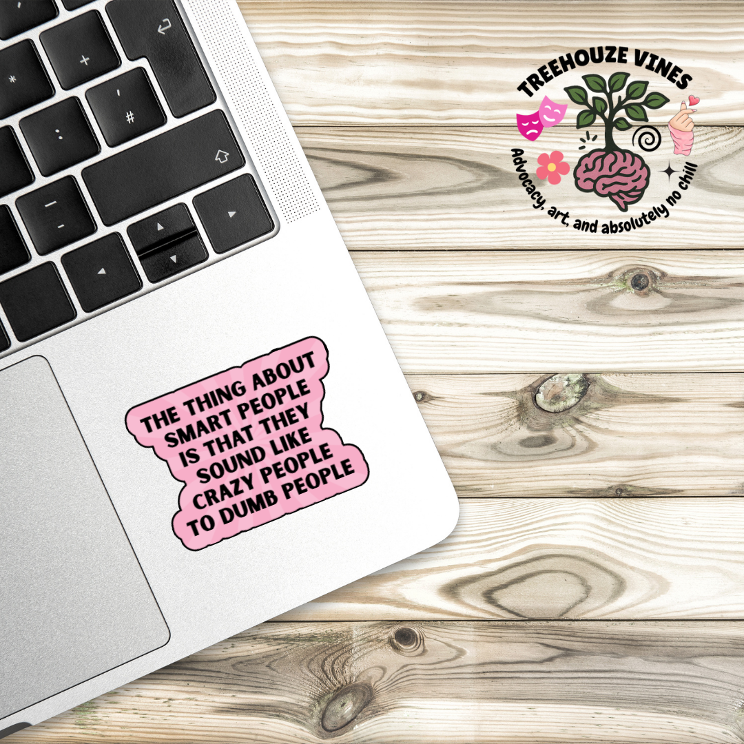 Holographic sticker with the quote “The thing about smart people is that they sound like crazy people to dumb people” in bold black lettering
