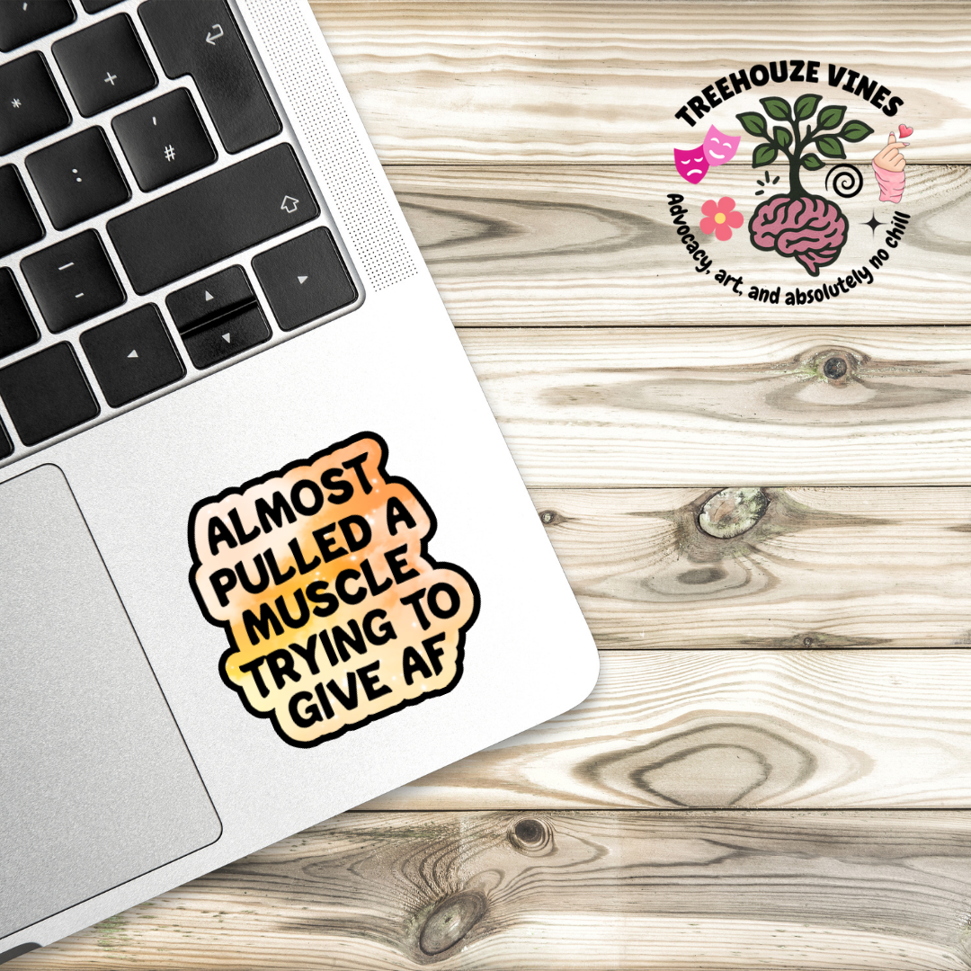 Holographic sticker that reads “Almost pulled a muscle trying to give AF” in bold black text over a peach-pink sparkle background