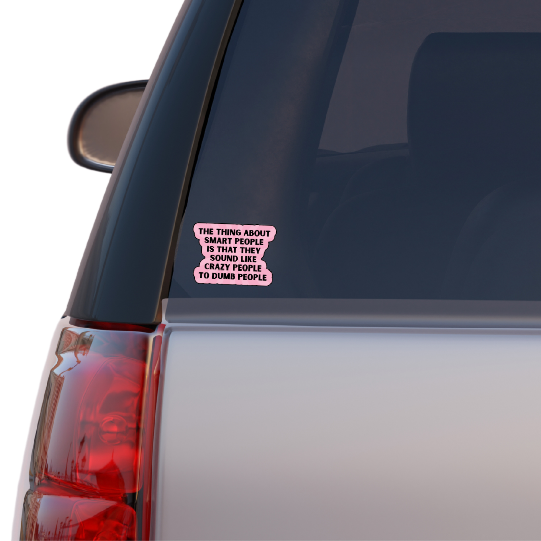 Holographic sticker with the quote “The thing about smart people is that they sound like crazy people to dumb people” in bold black lettering