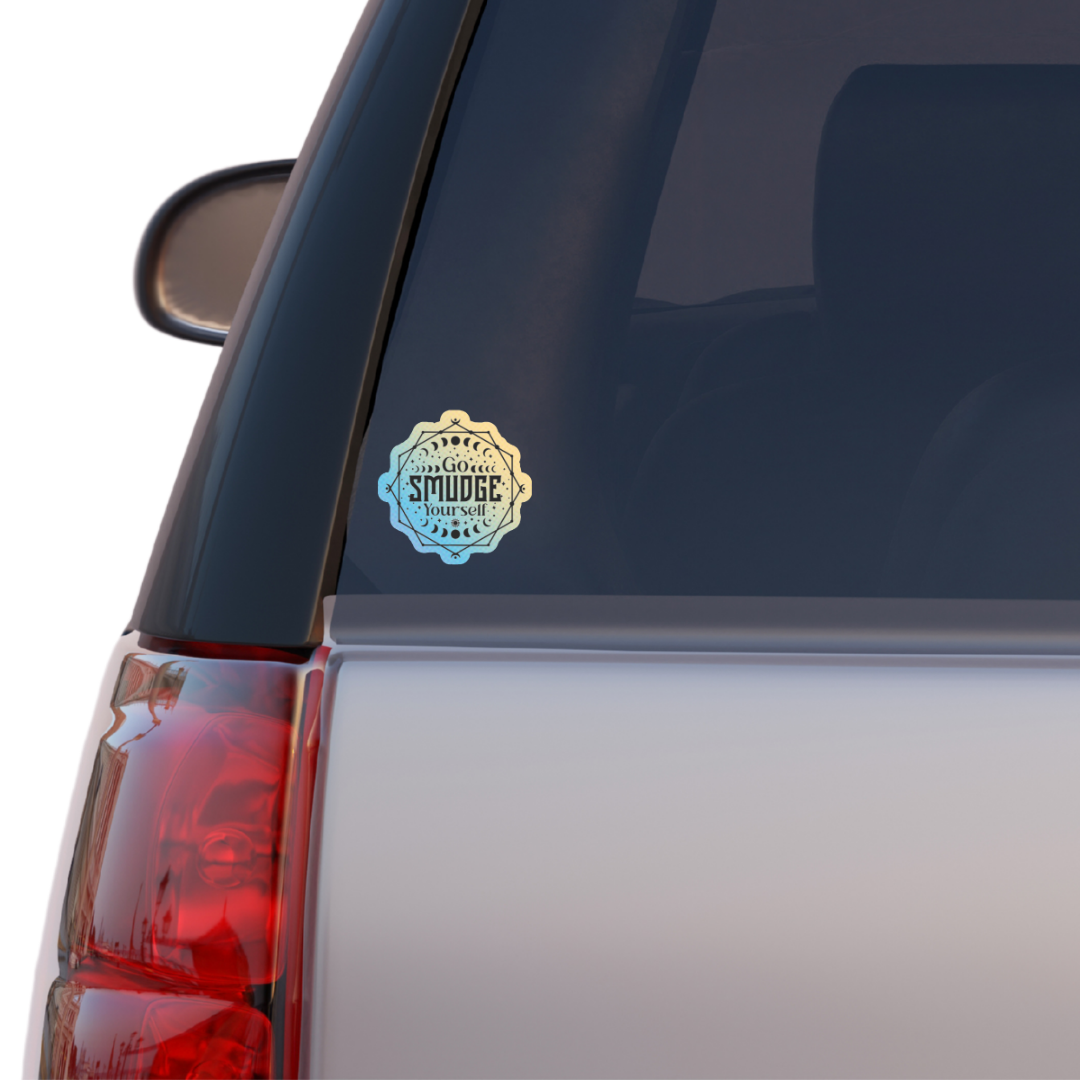 Holographic sticker with moon phases, sacred lines, and the phrase “Go Smudge Yourself” in bold black letters