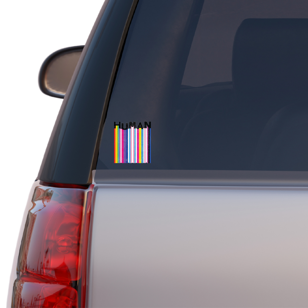 Square holographic sticker with rainbow barcode stripes and the word “HUMAN” in bold black text