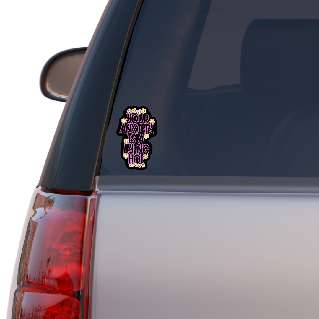 Holographic mental health sticker with the quote “Your Anxiety Is a Lying Hoe” in purple and white with flower doodles