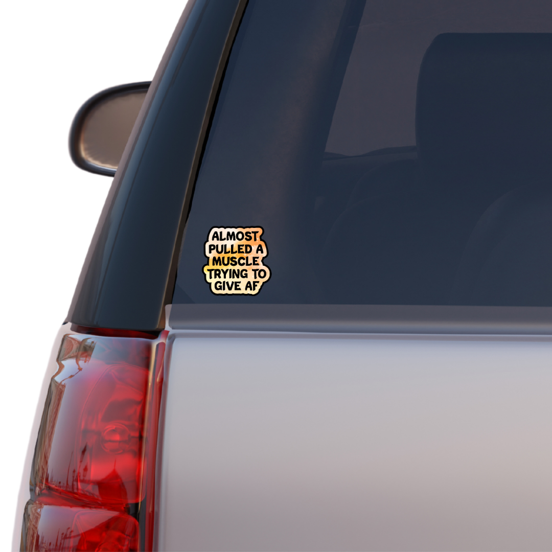 Holographic sticker that reads “Almost pulled a muscle trying to give AF” in bold black text over a peach-pink sparkle background