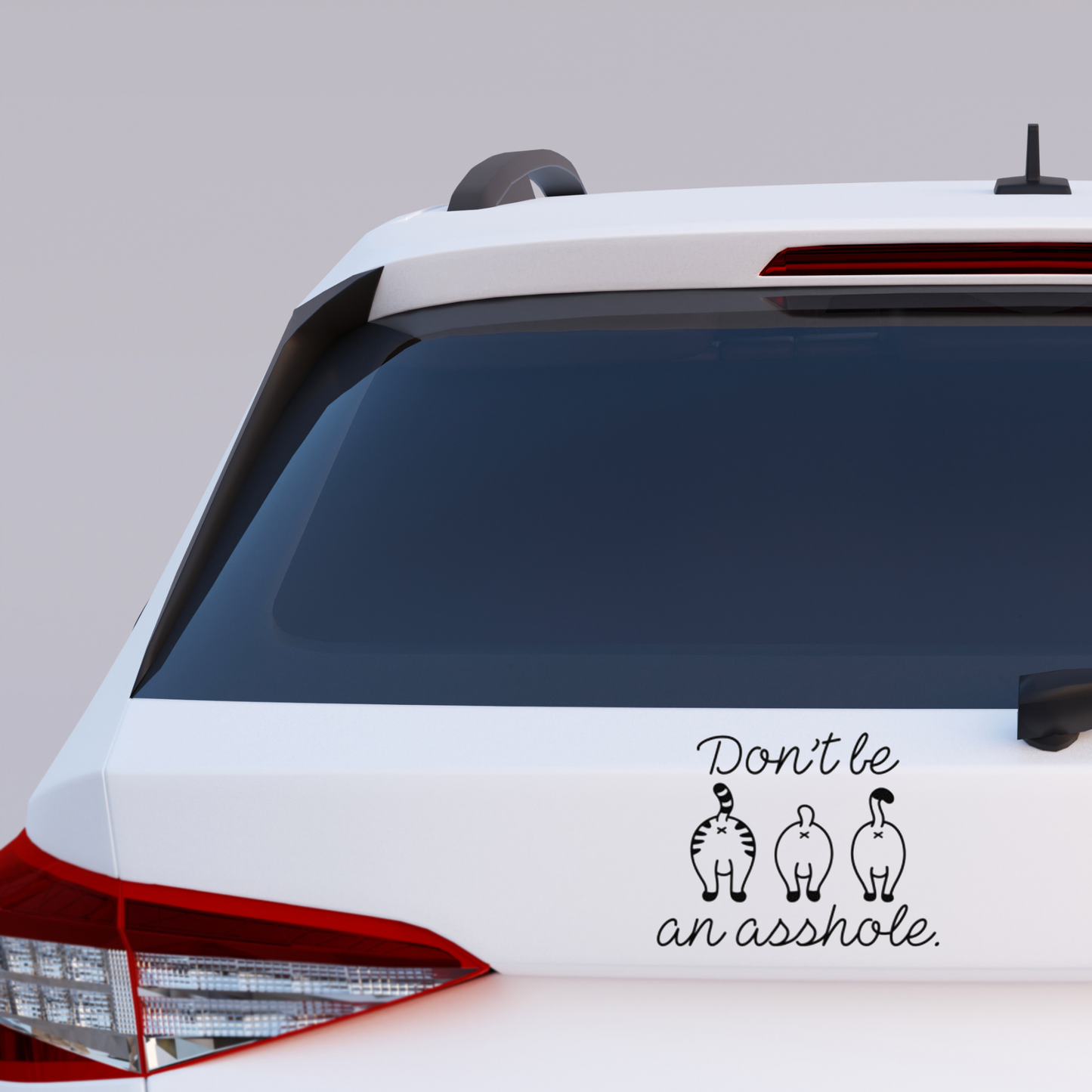 Vinyl decal with three cartoon cat butts and the phrase “Don’t be an asshole” in playful script