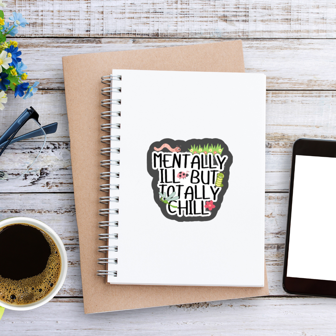 Holographic sticker that says “Mentally Ill But Totally Chill” with bugs, grass, and sparkles