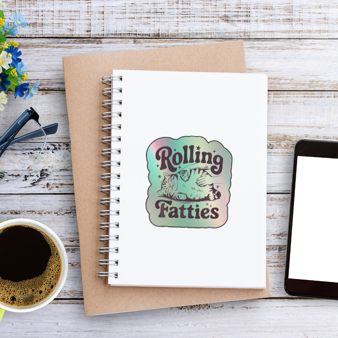 Holographic sticker with a hand rubbing a fat, relaxed cat and the phrase “Rolling Fatties” in playful black text