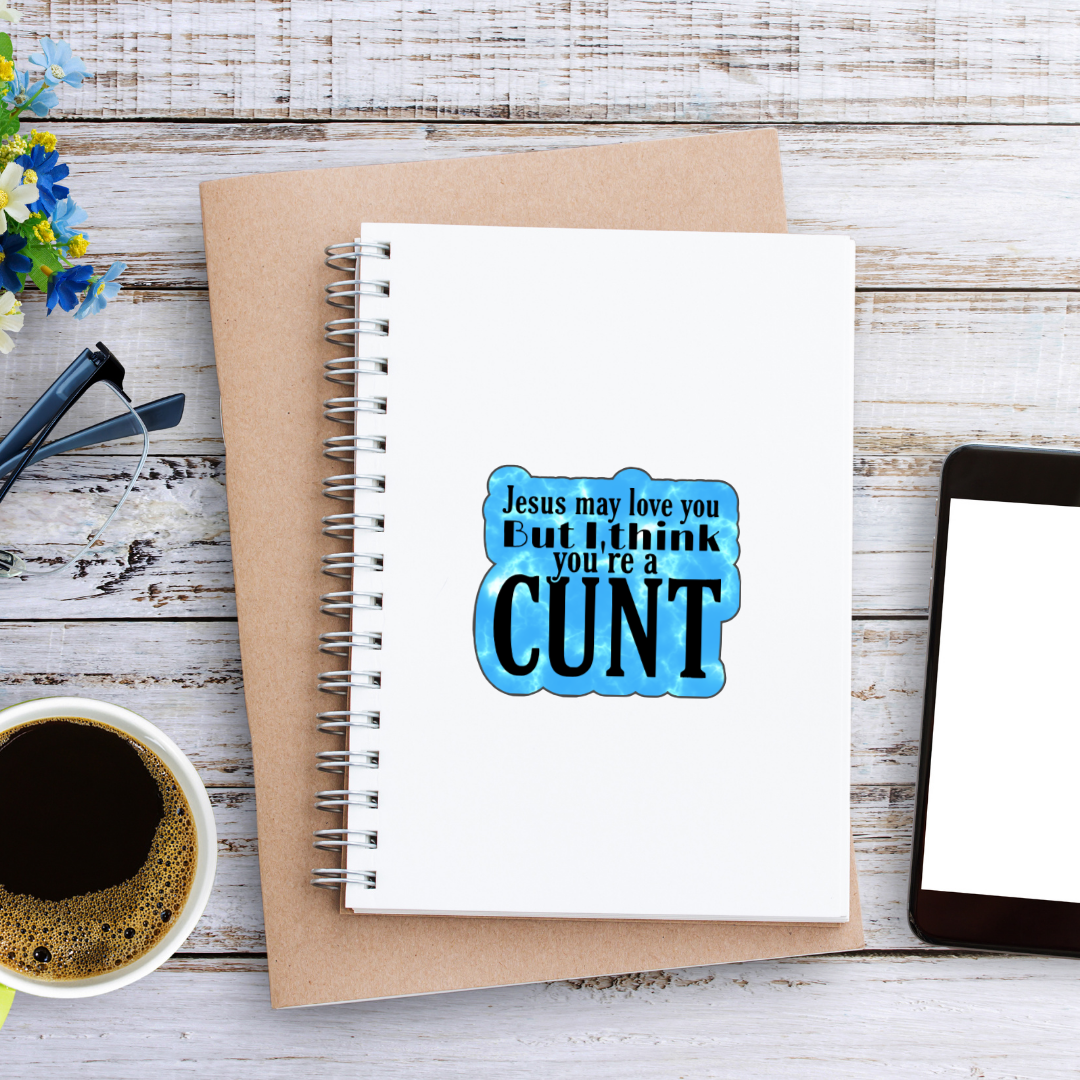 Holographic sticker that says “Jesus may love you but I think you’re a c*nt” in black text on a blue sparkle background
