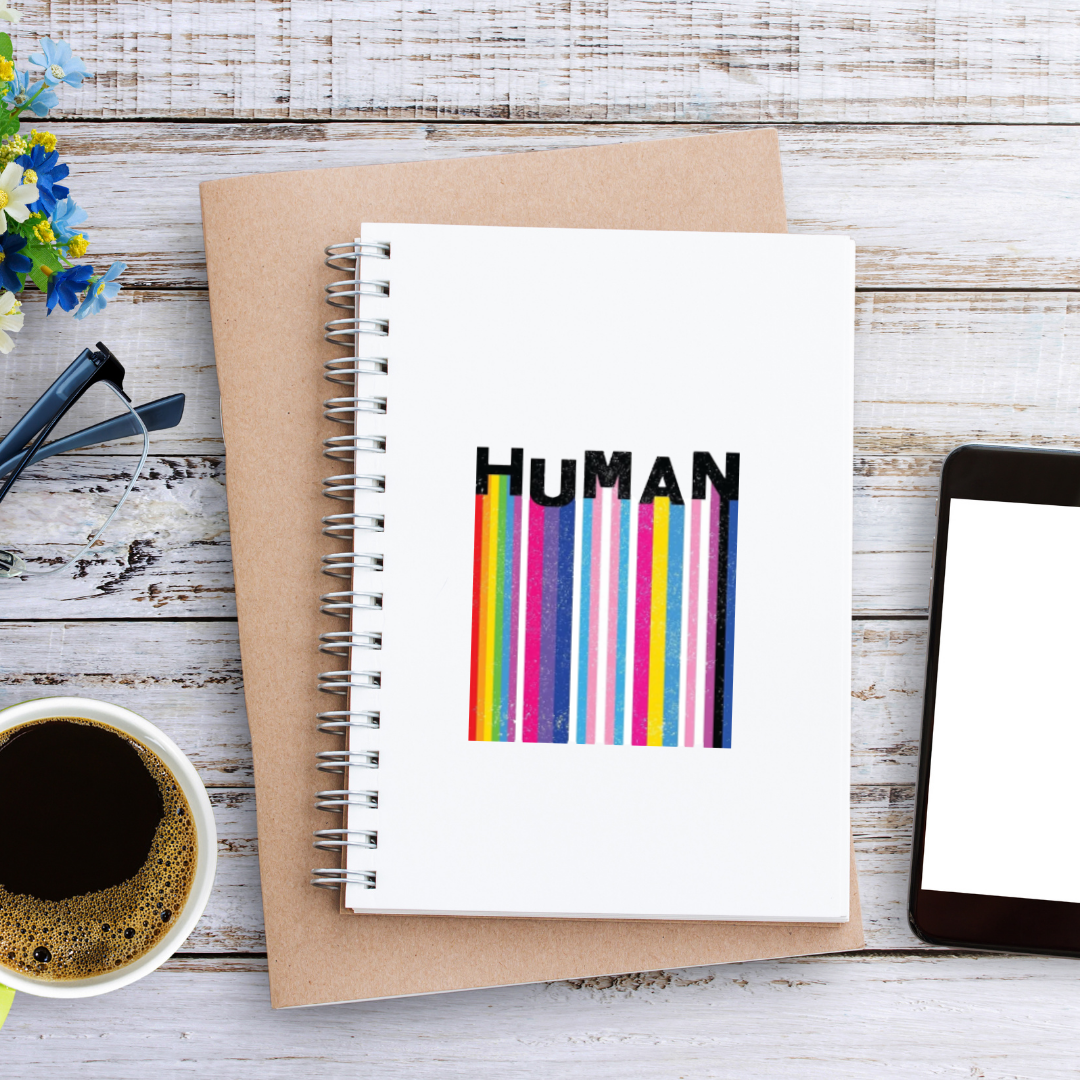 Square holographic sticker with rainbow barcode stripes and the word “HUMAN” in bold black text