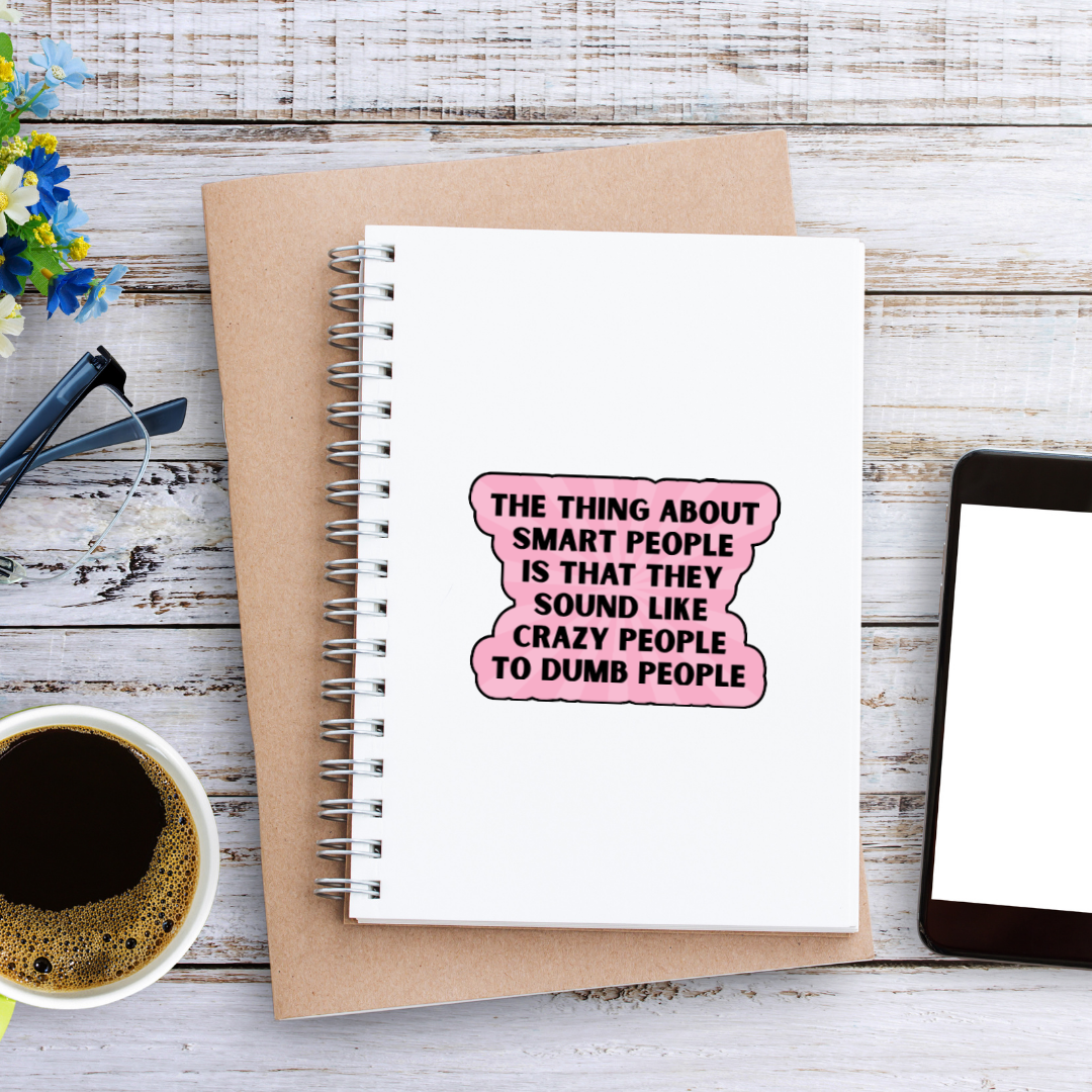 Holographic sticker with the quote “The thing about smart people is that they sound like crazy people to dumb people” in bold black lettering