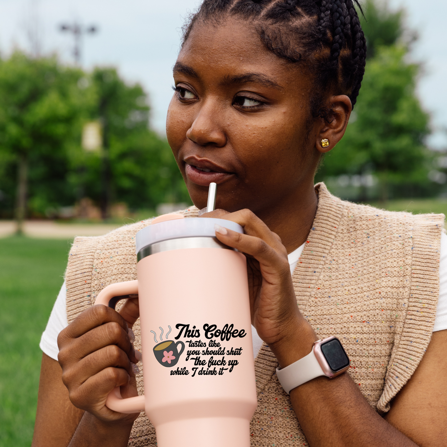 Vinyl decal of a steaming coffee mug with a pink flower and the phrase “This coffee tastes like you should shut the fuck up while I drink it”