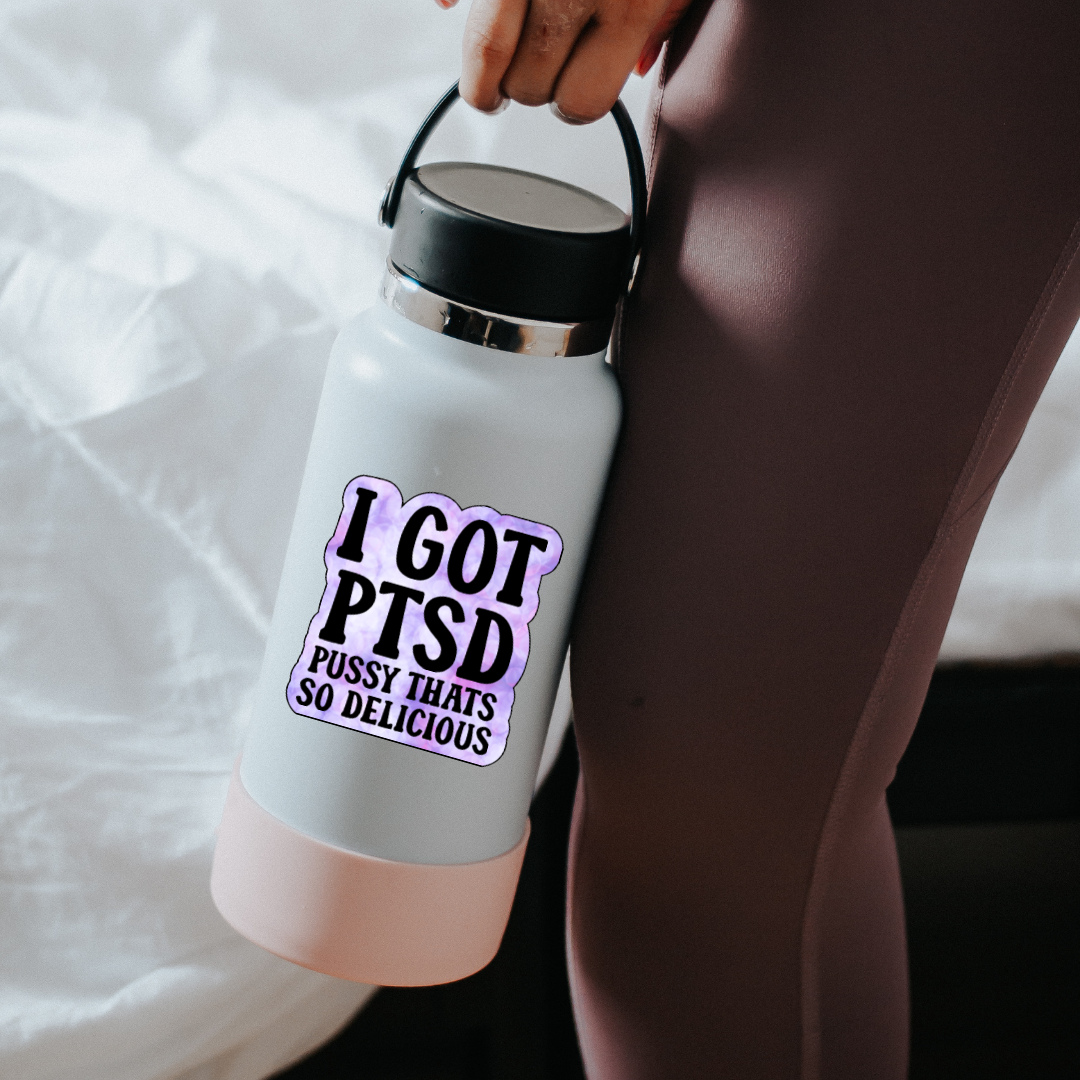 Purple tie-dye style sticker with bold black text that reads “I Got PTSD – Pussy That’s So Delicious”