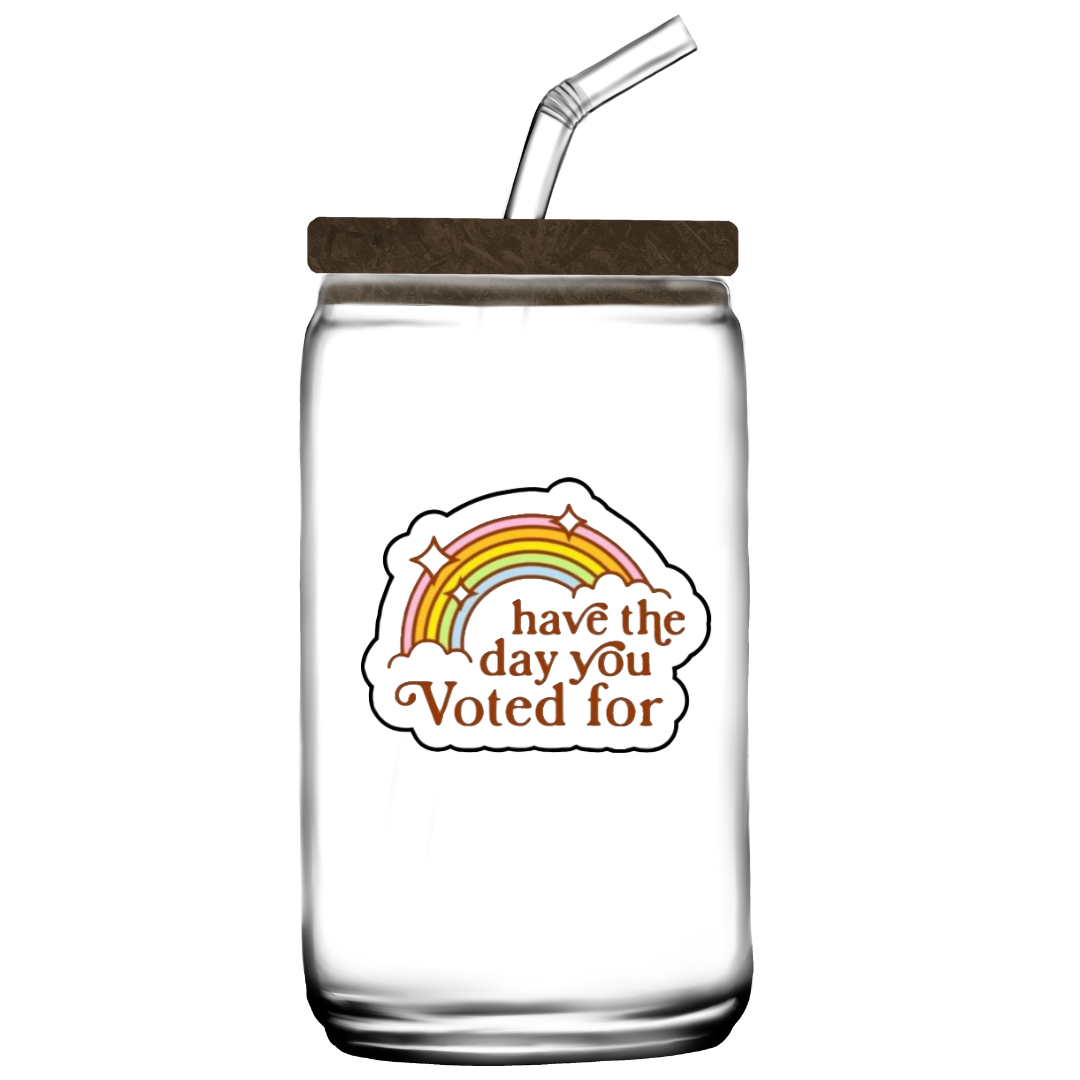 Retro rainbow sticker with the phrase “Have the Day You Voted For” in bold brown text and sparkles