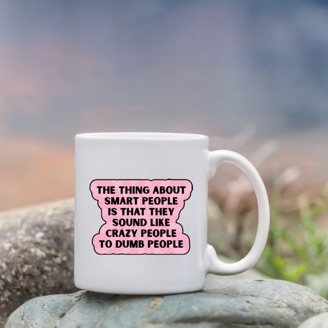 Holographic sticker with the quote “The thing about smart people is that they sound like crazy people to dumb people” in bold black lettering