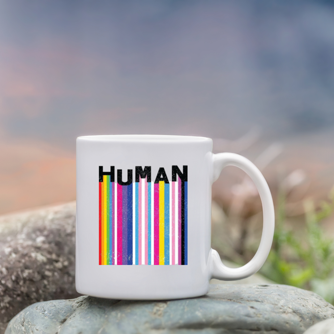 Square holographic sticker with rainbow barcode stripes and the word “HUMAN” in bold black text