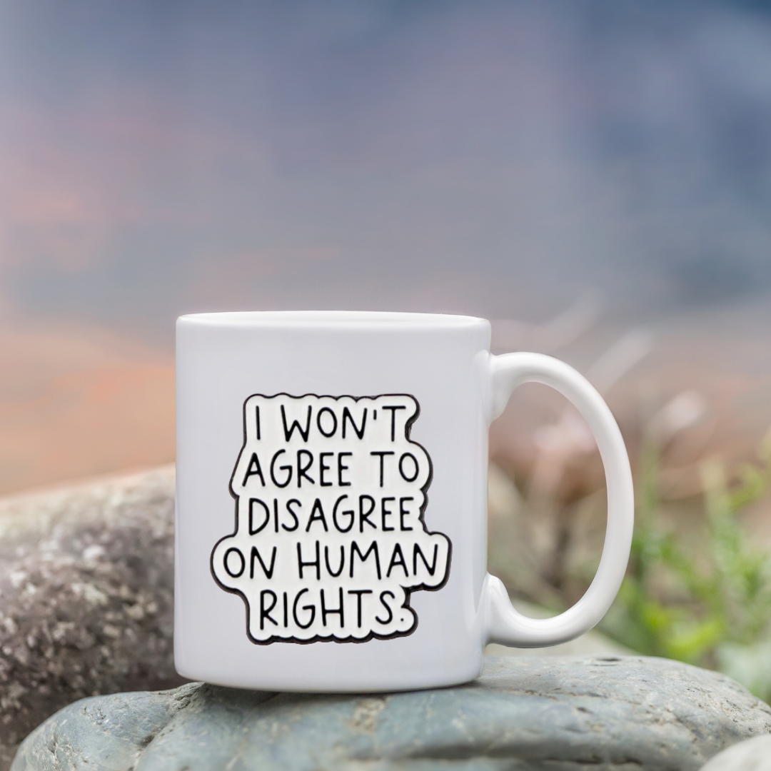 Sticker with handwritten-style text that says “I won’t agree to disagree on human rights” in bold black on white