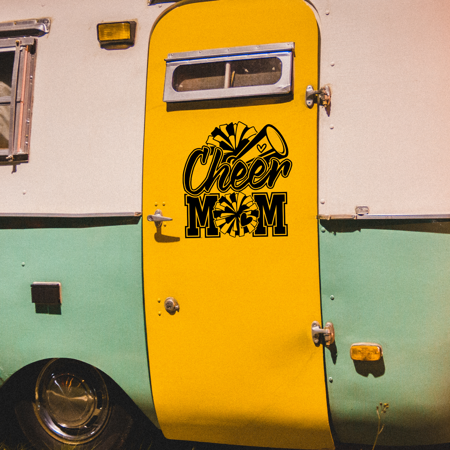 Black and white vinyl decal that says “Cheer Mom” with pom-poms, megaphone, and heart details