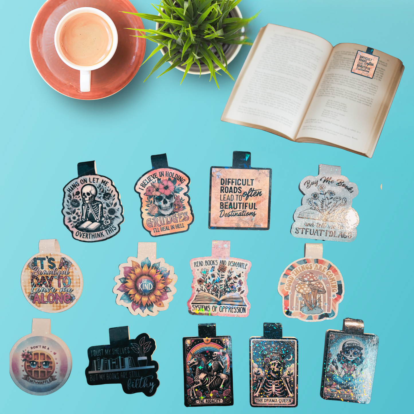 Collection of decorative magnet bookmarks on a blue background with a cup, saucer, and plant.