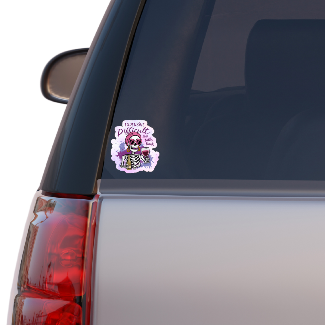 Sticker on a car window with a skull design and text.