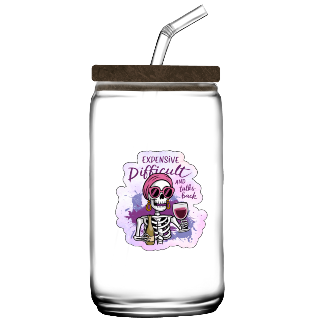 Clear glass mason jar with wooden lid and straw, featuring a colorful skeleton design and text on a white background.