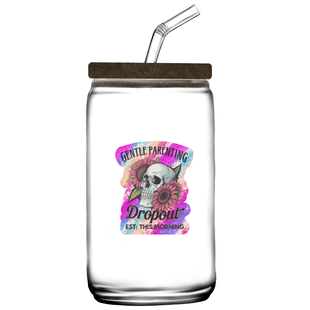 Clear mason jar with wooden lid and straw, featuring a colorful label with text and graphics.
