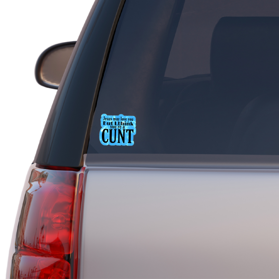 Holographic sticker that says “Jesus may love you but I think you’re a c*nt” in black text on a blue sparkle background