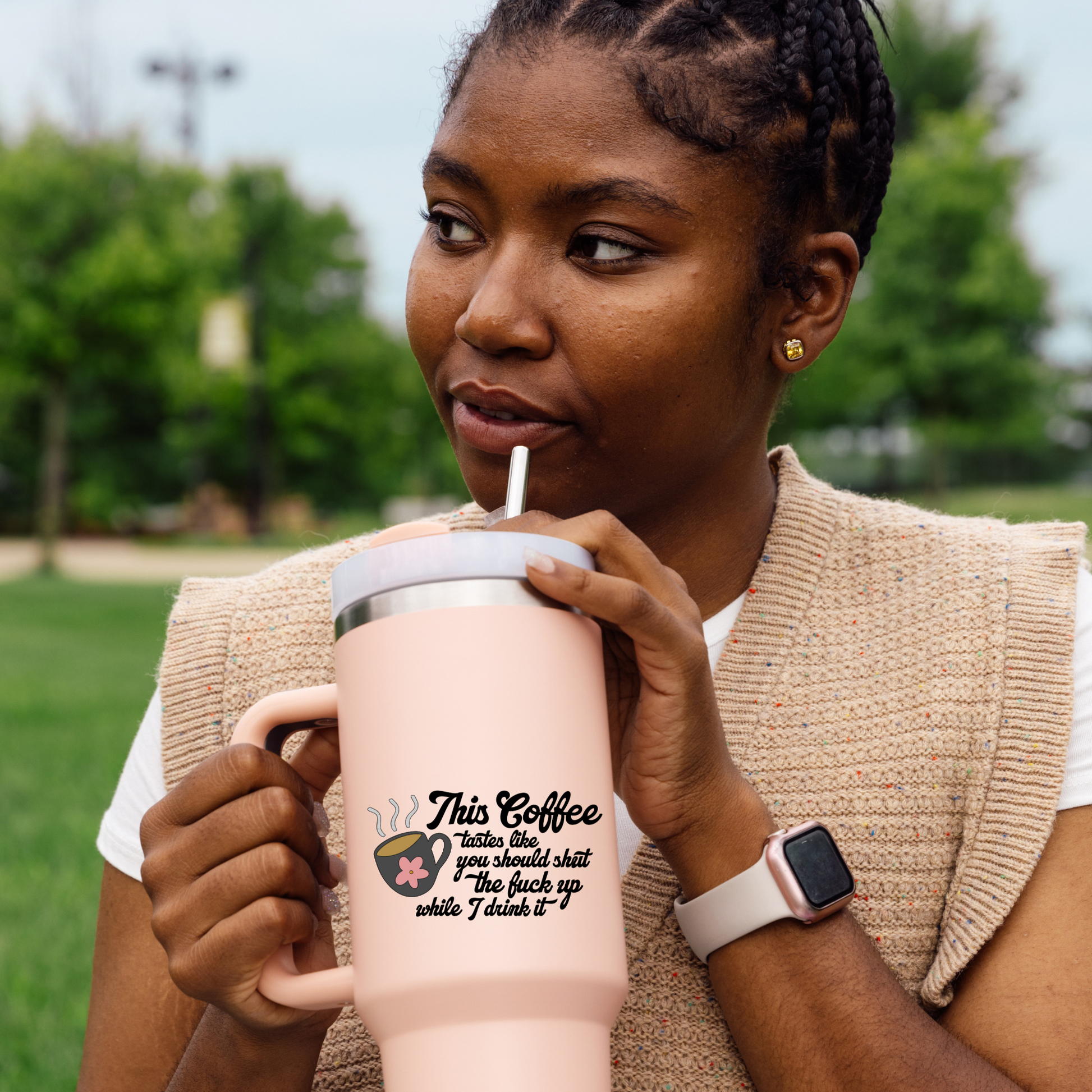 Vinyl decal of a steaming coffee mug with a pink flower and the phrase “This coffee tastes like you should shut the fuck up while I drink it”