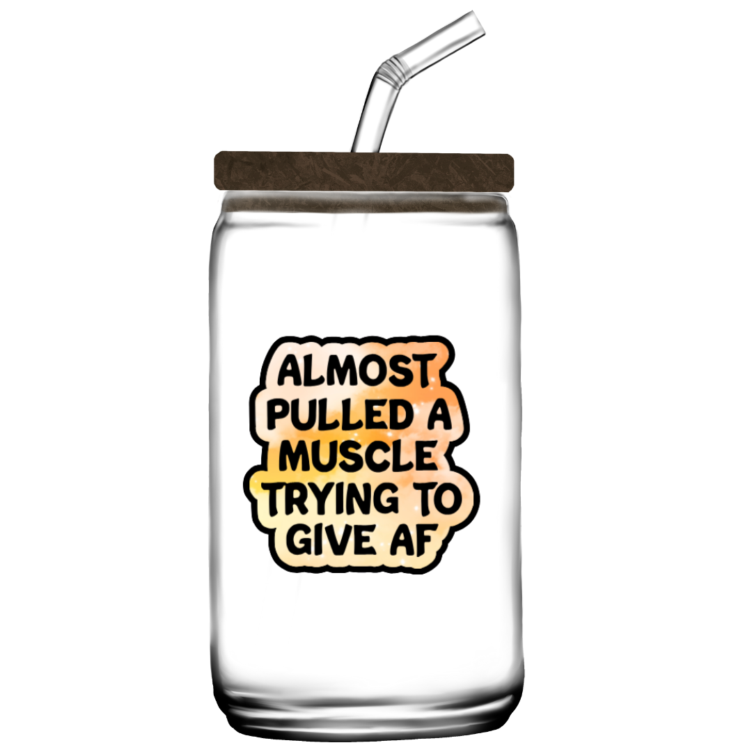 Holographic sticker that reads “Almost pulled a muscle trying to give AF” in bold black text over a peach-pink sparkle background