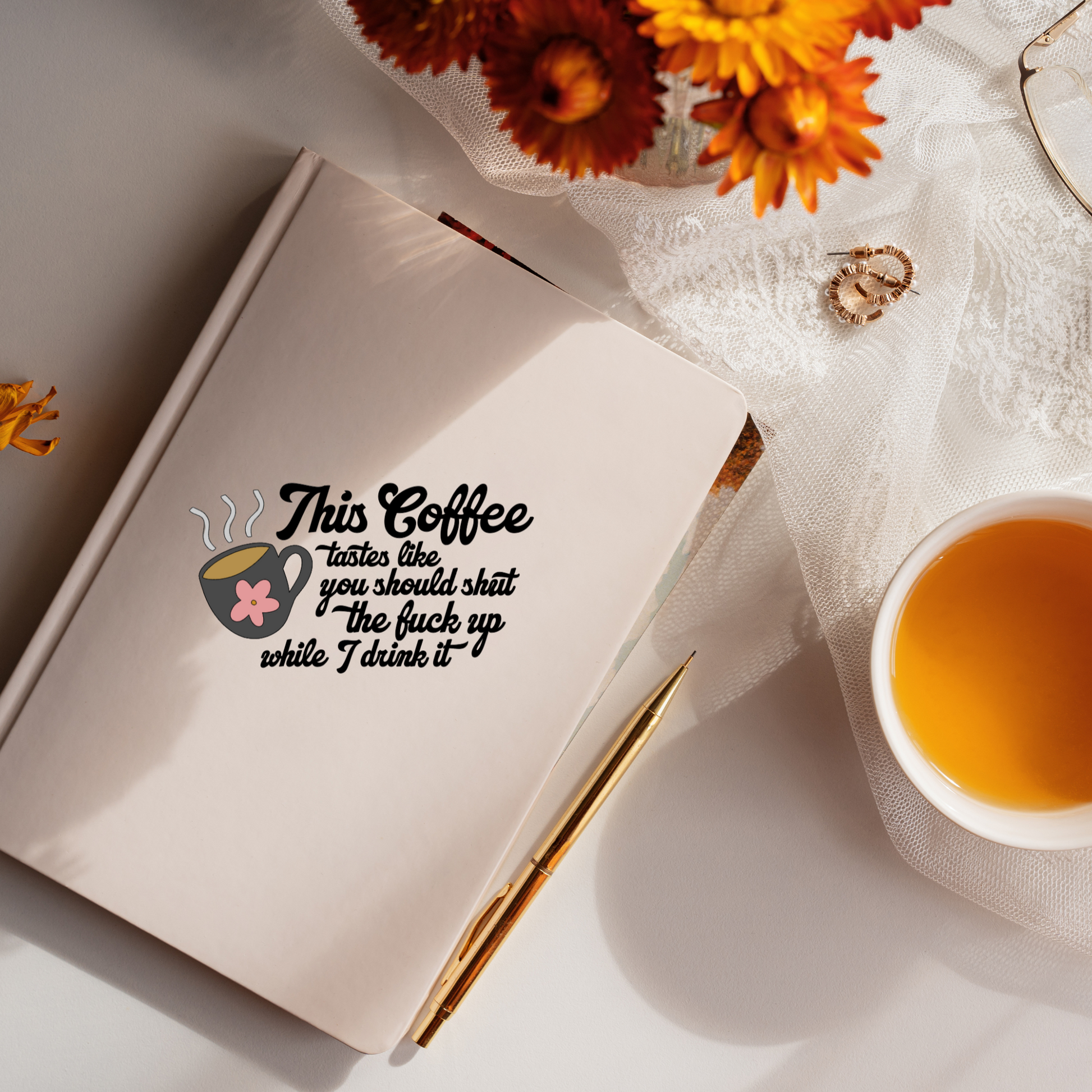 Vinyl decal of a steaming coffee mug with a pink flower and the phrase “This coffee tastes like you should shut the fuck up while I drink it”