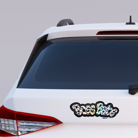 Bold vinyl decal that says “Boss Babe” in holographic cheetah print lettering with black layered outline.
