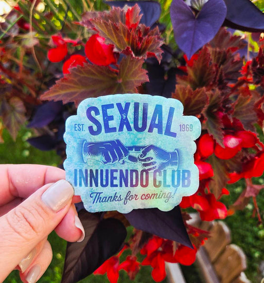 Green sticker with vintage hands and bold black text that reads “Sexual Innuendo Club – Thanks for coming!”